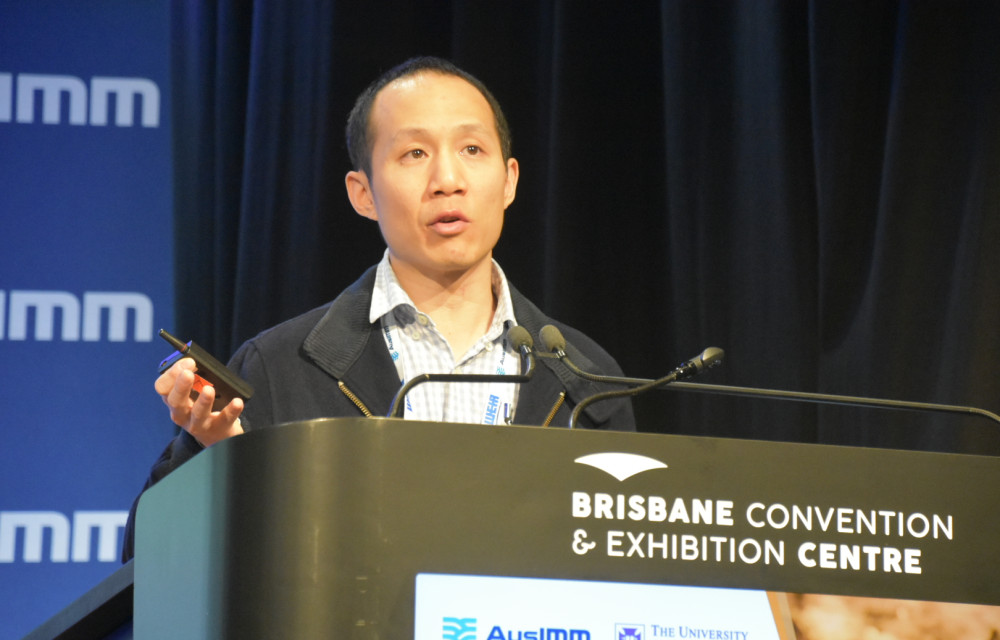 Lieven Tan presenting research on soil cover systems for acid mine drainage control at the Life of Mine Conference 2025 in Brisbane.